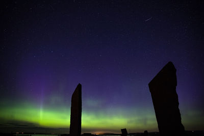 Northern lights with stones of stenness, orkney islands, uk.