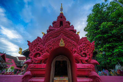 Low angle view of statue of building against sky