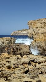 Scenic view of sea against clear blue sky