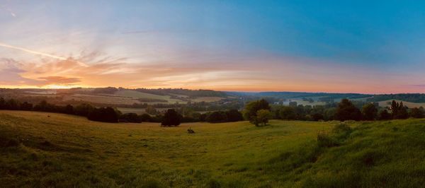 Scenic view of landscape against sky during sunset