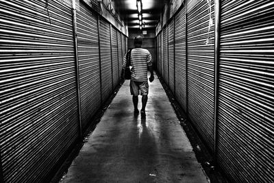 Woman walking in tunnel