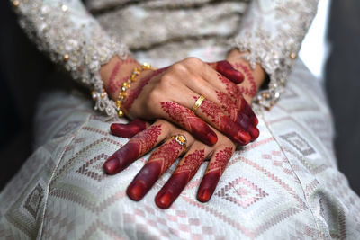 Close-up of bride hands