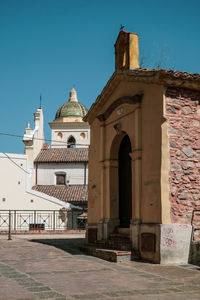 Exterior of historic building against clear sky