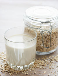 Vegan non dairy alternative milk. oat flakes milk