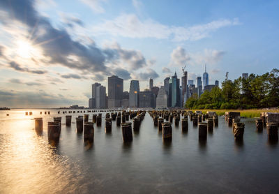 Panoramic view of sea and buildings against sky