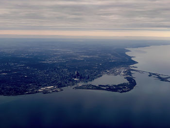 Aerial view of city by sea