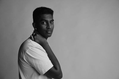 Portrait of young man against white background