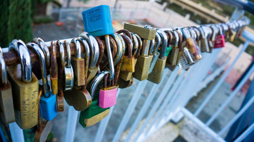 Close-up of padlocks on railing