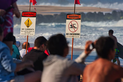 Group of people against the sea