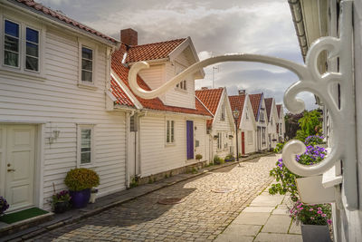 Street amidst buildings against sky