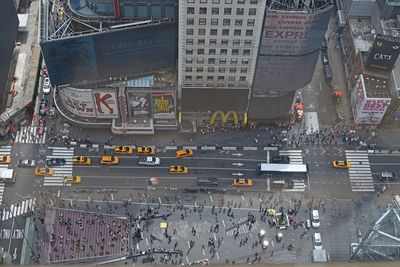 High angle view of people walking on road