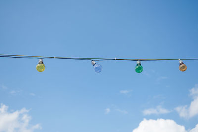 Low angle view of cables against clear blue sky