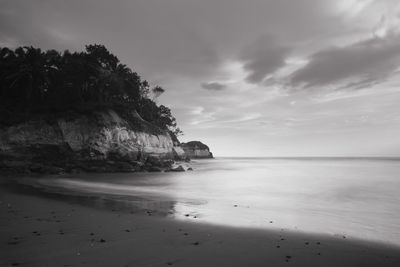 Long exposure photo of a beach, a beach with steep cliffs in indonesia