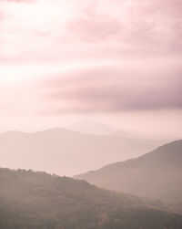 Scenic view of mountains against sky during sunset