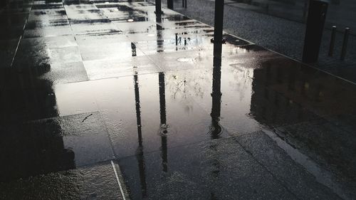 Reflection of building in puddle