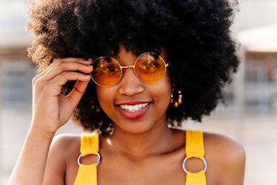 Portrait of young woman with curly hair