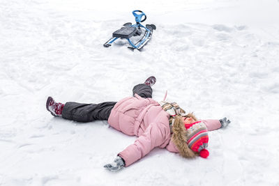 High angle view of woman skiing on snow