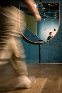 Low section of man playing piano