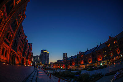 Illuminated buildings in city at night