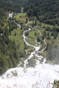 High angle view of waterfall amidst trees