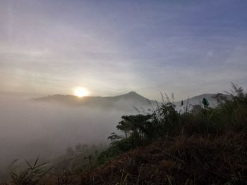 Scenic view of mountains against sky during sunset