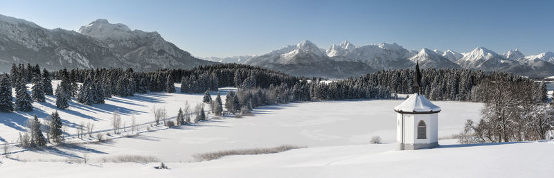 Panoramic view of snow covered land