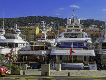 Sailboats moored in marina