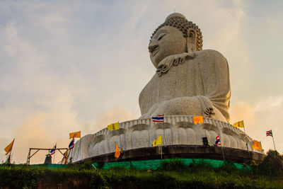 Low angle view of statue against sky