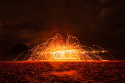 Light painting on beach at night