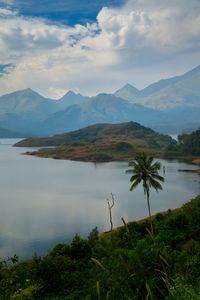 Scenic view of lake against cloudy sky