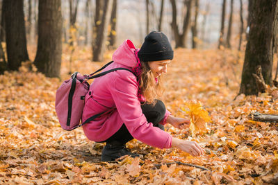 Rear view of woman standing in park