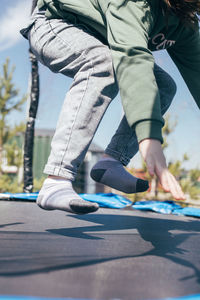 Low section of man skateboarding