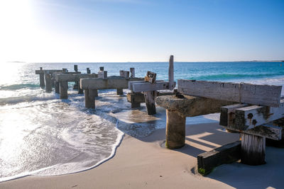 Scenic view of beach against clear sky