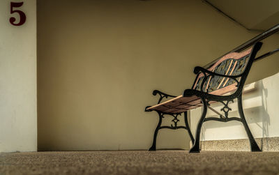 Empty chairs and table against wall at home