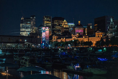 High angle view of illuminated buildings in city at night