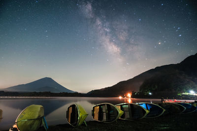 Scenic view of mountains against sky at night