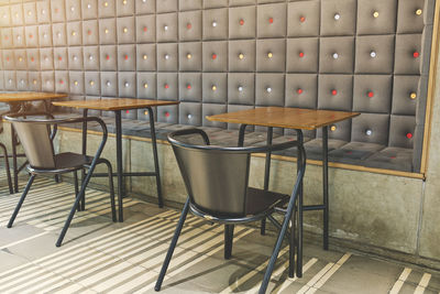 Empty chairs and tables in restaurant