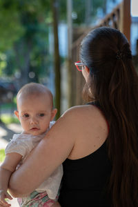 Close-up of mother and daughter outdoors