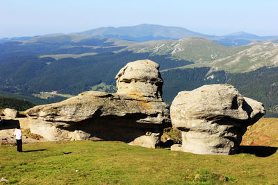 Majestic rock formations at babele on bucegi mountains against clear blue sky