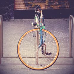 Low section of man riding bicycle on street