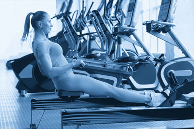 Low section of woman exercising in gym