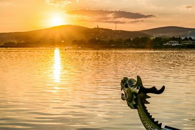 Scenic view of lake during sunset