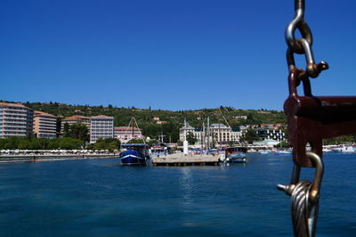 Scenic view of river against clear blue sky