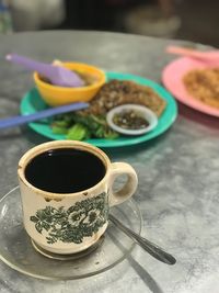 Close-up of tea cup on table