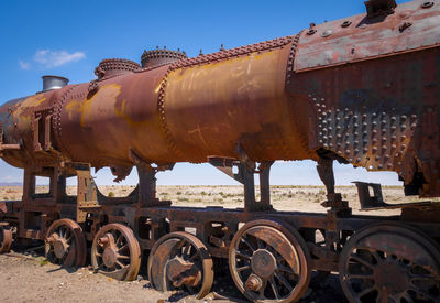 Train at railroad station platform against sky