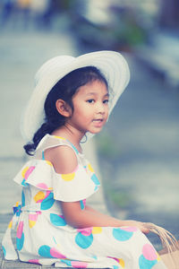 Portrait of cute girl wearing hat