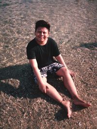 Portrait of smiling young woman at beach