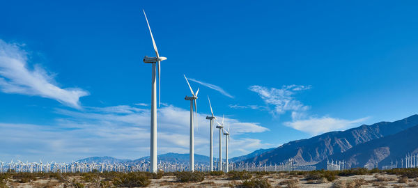 Low angle view of wind turbine against sky