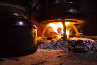 Close-up of fire under stove