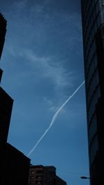 Low angle view of vapor trails in sky